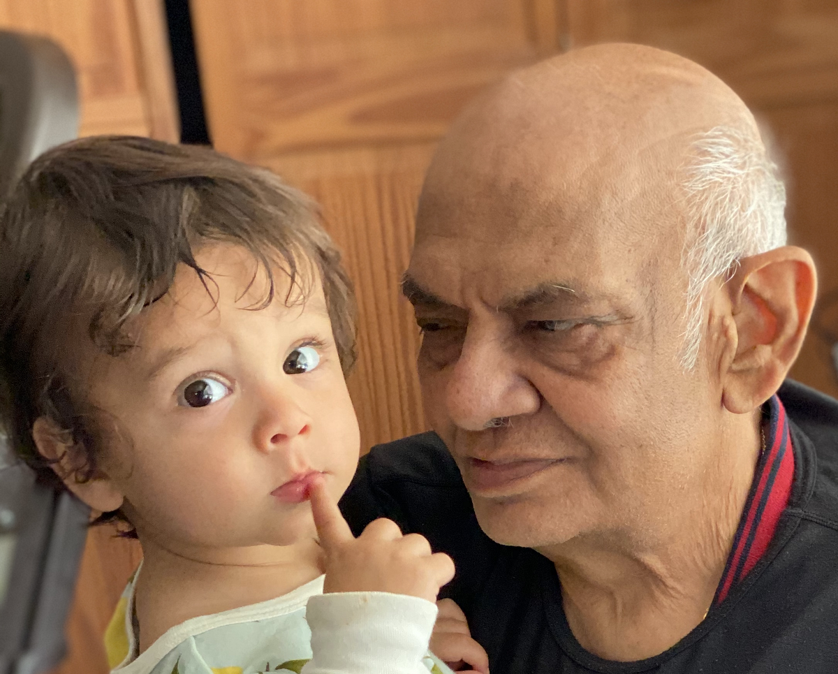 Taken during our last trip to North Carolina. My son is likely pondering some way to escape our grasp and stay with his grandparents who cater to his every whim.